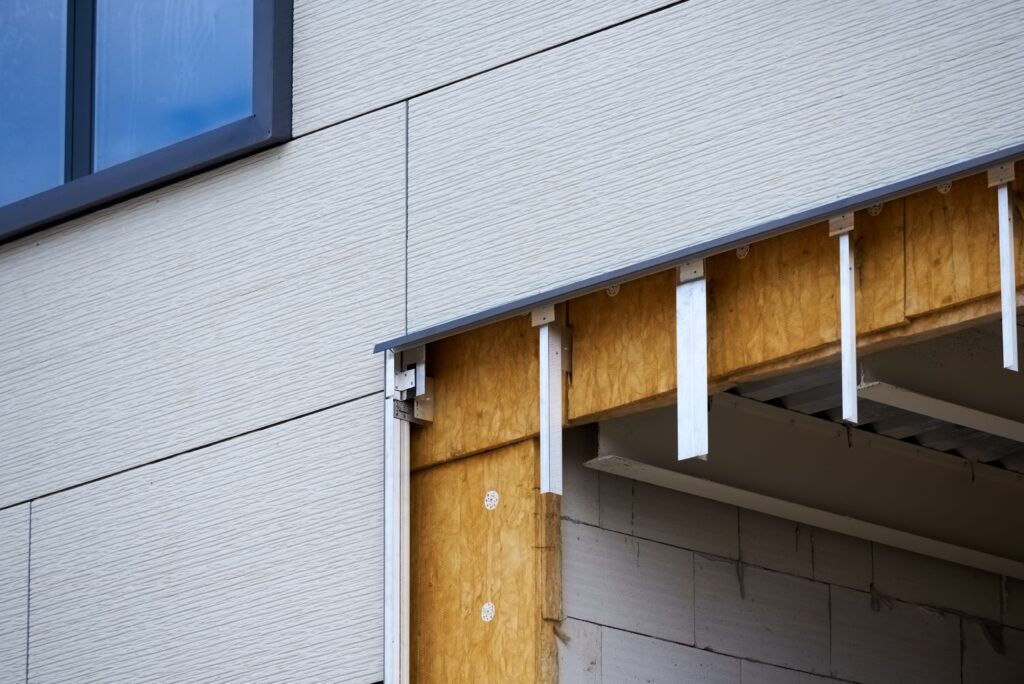 office building under construction. Facing and insulation of walls